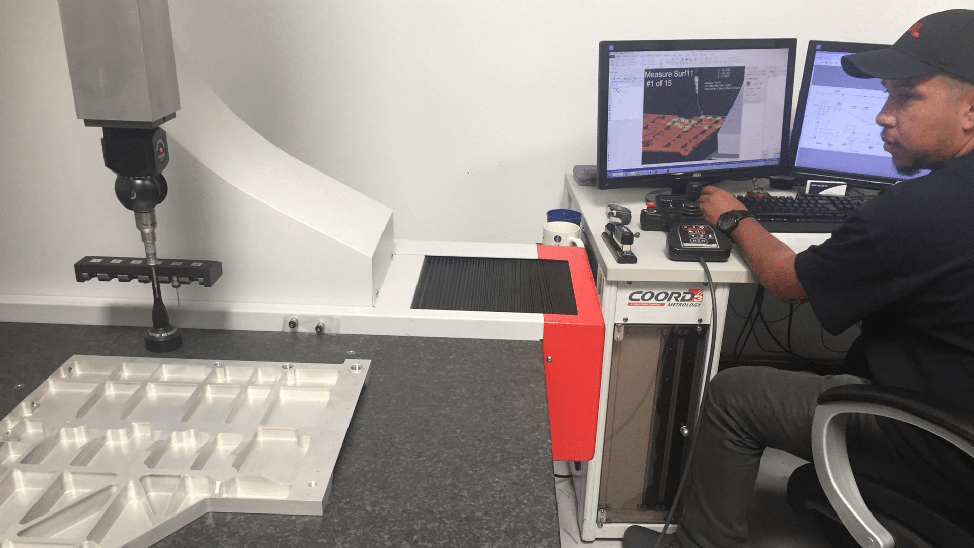 operator running inspection plan on Coord3 CMM using Verisurf software operator running inspection plan on Coord3 CMM using Verisurf software